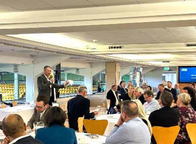 Photograph of Nick Steven-Jones addressing the joint meeting of Norfolk and Suffolk Business Boards at Carrow Road.